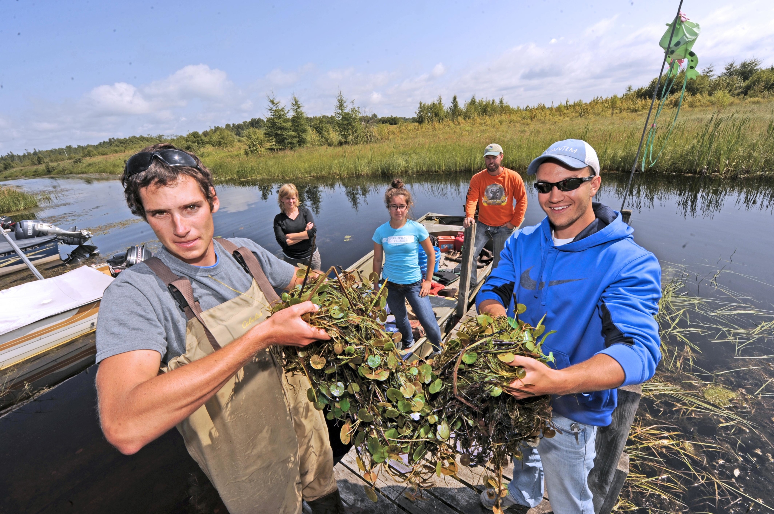 Students collect samples from the lake