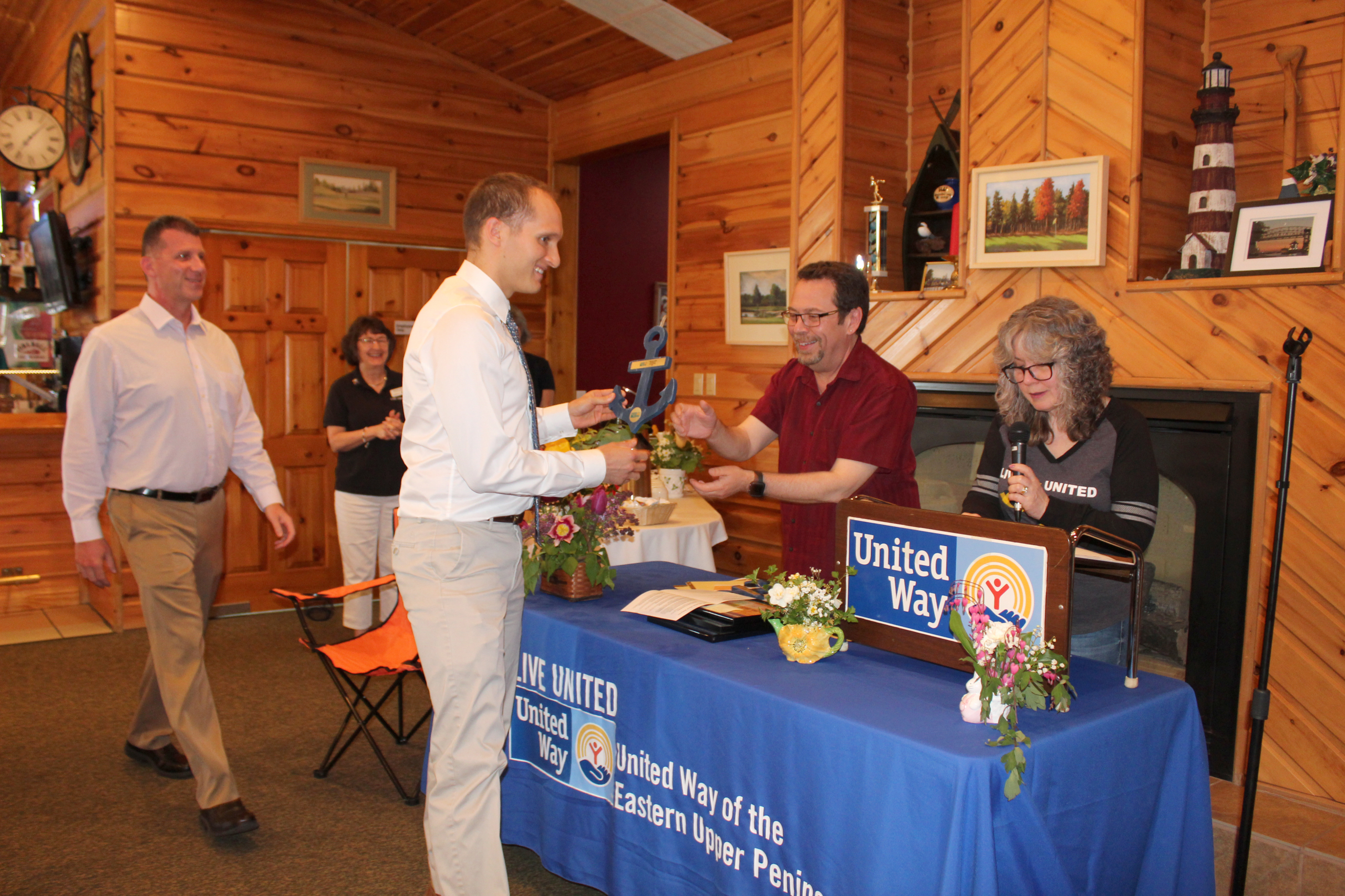 LSSU Athletic Communications Director Mark Vassey accepting the Community Builder Award from Mark and Sharon SanAngelo, 2018 UWEUP Campaign Chairs