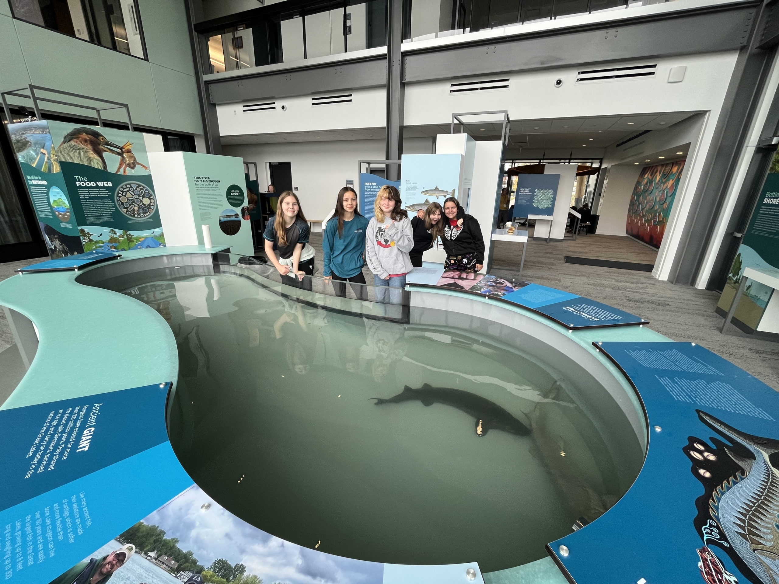 Students at the sturgeon tank.